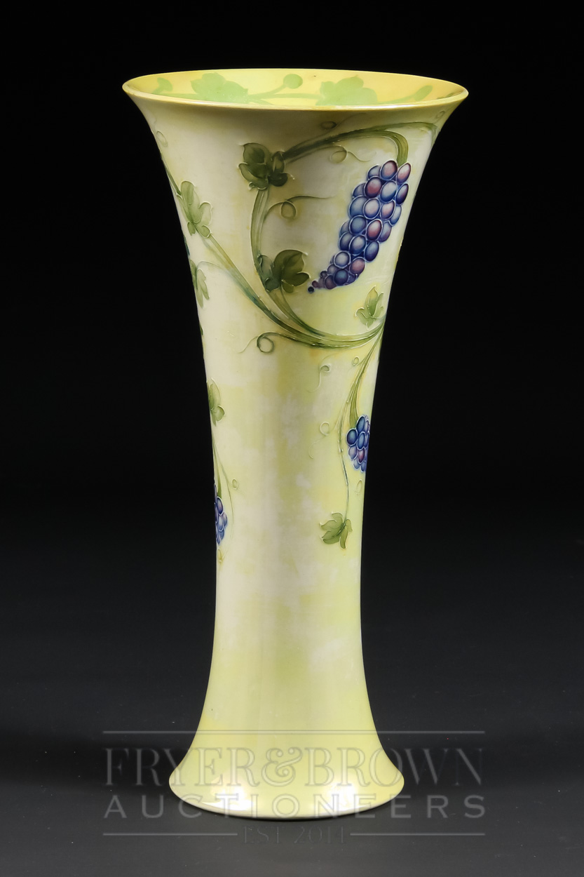 A rare Moorcroft lustre vase of trumpet form, the pale yellow lustre ground decorated with grapes - Image 2 of 6