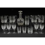 Nine cut crystal glasses; four etched glass half-pint mugs; and a small cut crystal decanter (14)