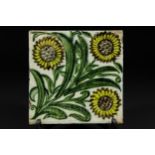 A William de Morgan Bedford Park tile, the pale grey ground decorated with three leafy sunflowers to