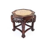 A Chinese hardwood octagonal stand, with inset marble top, 46cm high