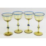 Four Murano wine glasses, the smoked glass with blue prunts to stem