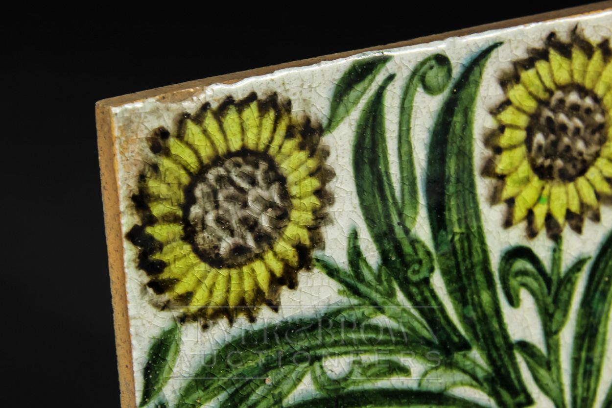 A William de Morgan Bedford Park tile, the pale grey ground decorated with three leafy sunflowers to - Image 3 of 4