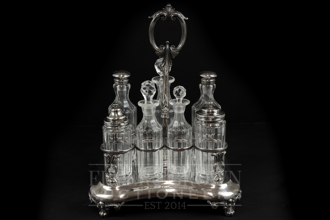 A silver plated cruet, c1880, with seven cut glass bottles