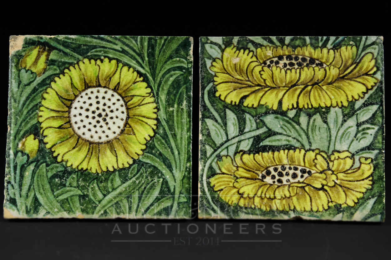 Two William de Morgan earthenware tiles, Marlborough, yellow sunflowers on a leafy green ground,