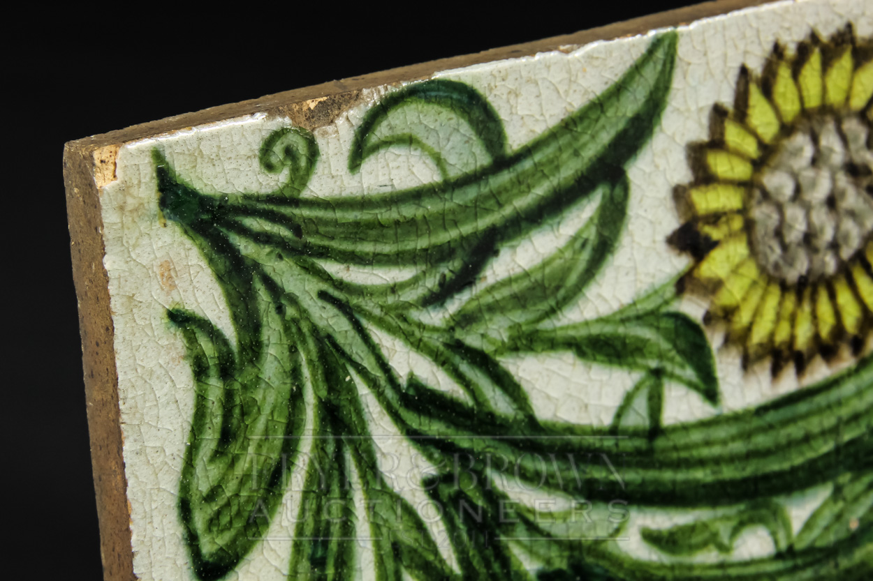 A William de Morgan Bedford Park tile, the pale grey ground decorated with three leafy sunflowers to - Image 4 of 4