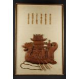 A Vietnamese carved wood wall plaque, mounted on hessian with carved script, depicting a dragon boat