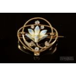 An Art Nouveau 15 carat gold, pearl, diamond and enamel brooch/pendant, c1900, the stylised