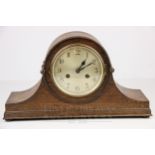 An oak cased Napoleon shape mantel clock