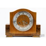 An Art Deco walnut mantle clock, Enfield movement, roman numeral face
