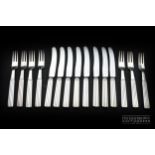 An unusual set of Art-Deco silver fruit knives and forks by Georg Jenson circa 1930,each knife and