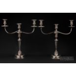 A pair of Sheffield plate three light candelabra, on reeded vase columns, 48.5cm high