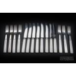 An unusual set of Art-Deco silver fruit knives and forks by Georg Jenson circa 1930,each knife and