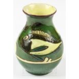 A small C.H. Brannam vase decorated with Sgraffito fish on a dark green ground; and a small three-