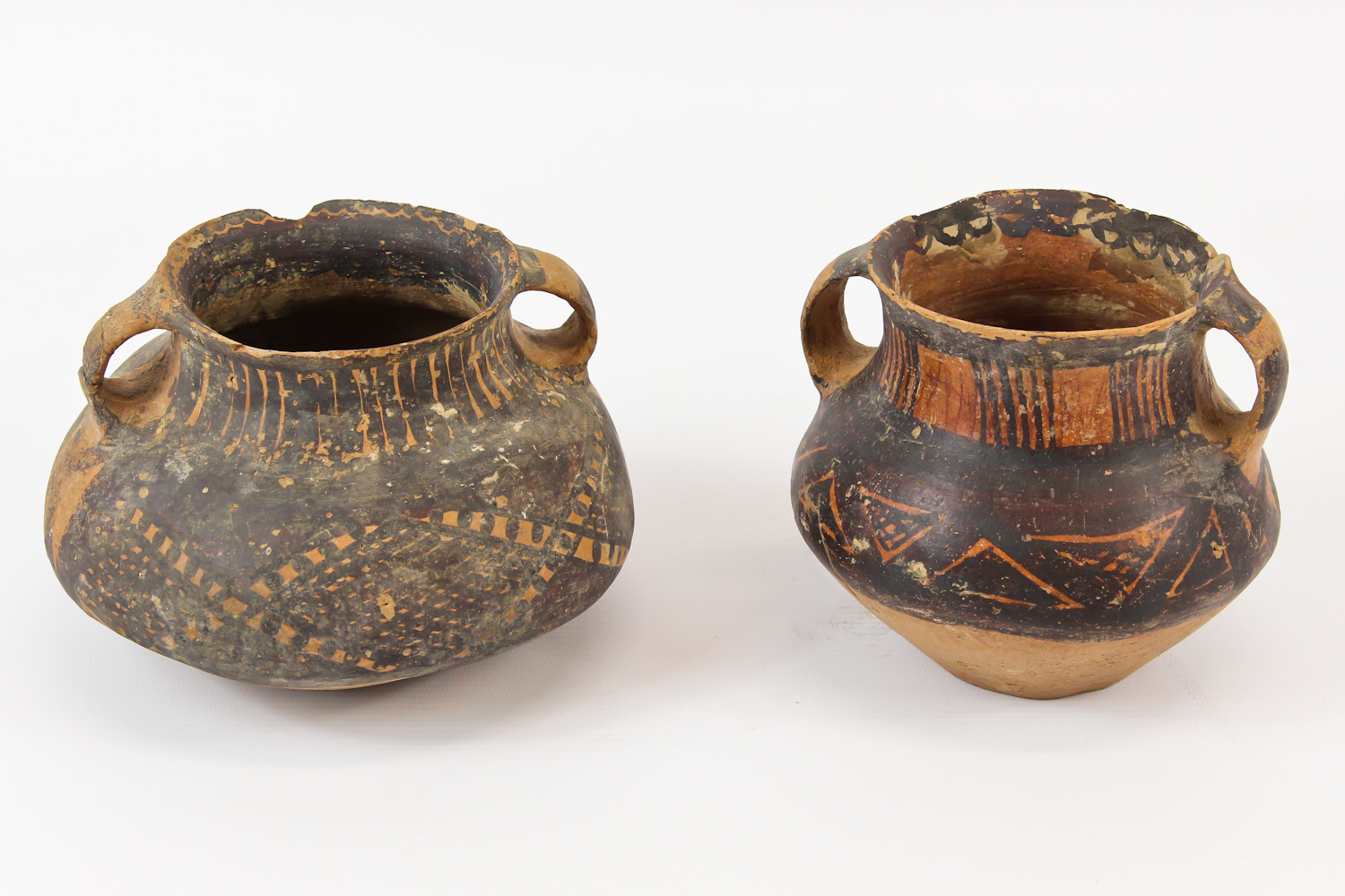 Two Chinese Neolithic redware pottery urns, each of squat globular form, with loop handles to the - Image 3 of 8