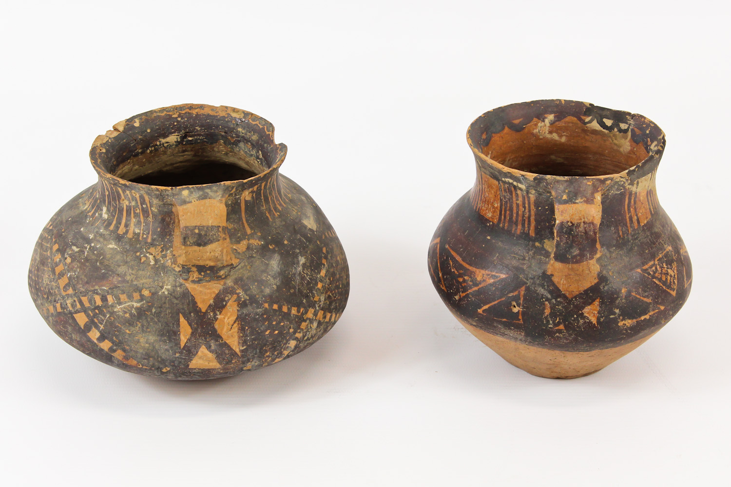 Two Chinese Neolithic redware pottery urns, each of squat globular form, with loop handles to the - Image 4 of 8