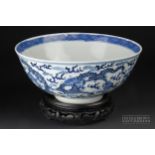 A Chinese blue & white porcelain bowl, painted with scaly dragons and clouds, blue Kangxi four