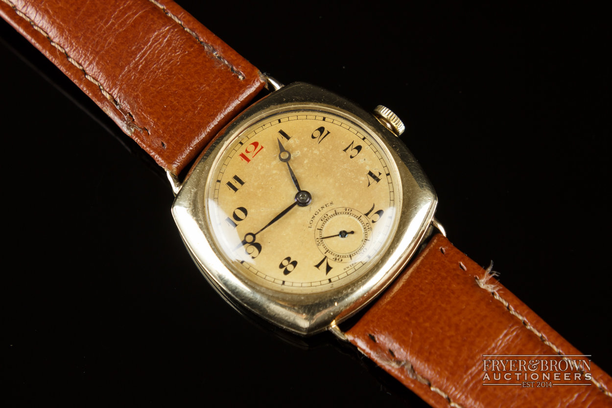 A vintage 9ct gold Longines cushion shaped gentleman's wrist watch, c1930, the Champagne coloured