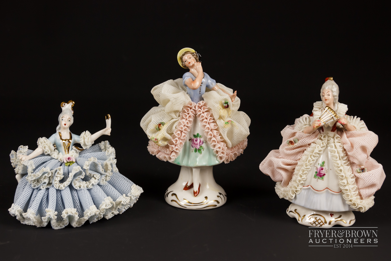Two small Dresden porcelain lace crinoline figures in Marie Antoinette style; and another, 10.5cm