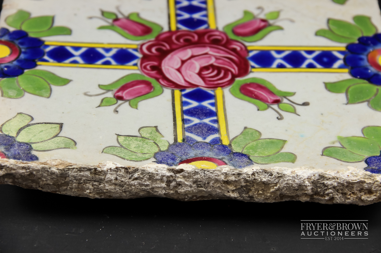 A Qajar tile, brightly glaze with a Damascus rose and four rose buds on crossed band, 19.5cm square - Image 3 of 3