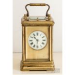 A good antique repeater carriage clock, c1890, the lacquered gilded brass corniche case with a