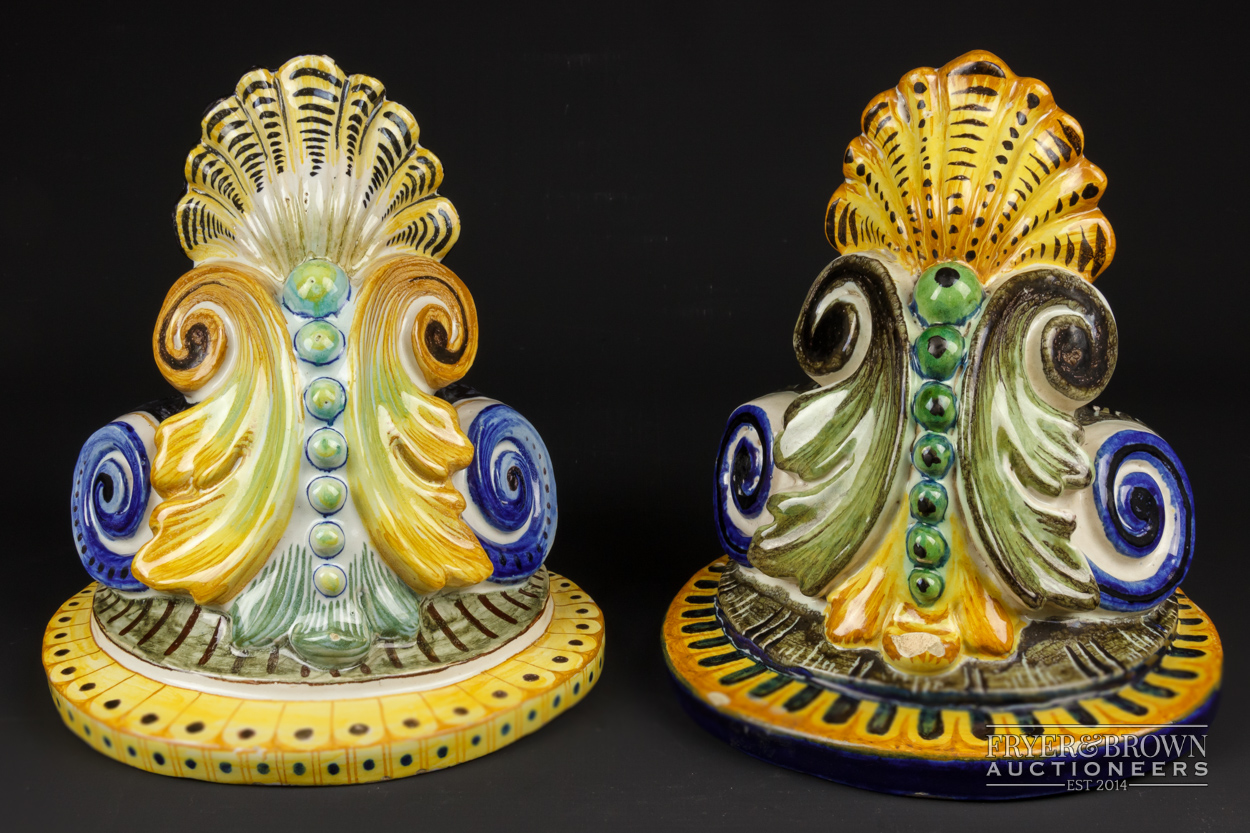 A matched pair of Cantagalli maiolica wall brackets of foliate 'C' scrolls and scallop shell design,
