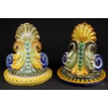 A matched pair of Cantagalli maiolica wall brackets of foliate 'C' scrolls and scallop shell design,