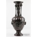 A bronze bottle neck vase, decorated with birds, foliage and grotesques, c1900, 37.5cm high approx.