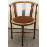 A mahogany tub chair with pierced back splats, round seat, on turned legs with X-stretcher