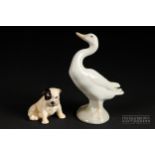 A Royal Doulton figure of a bulldog puppy, marked K2 to base with trademark stamp; and a Lladro