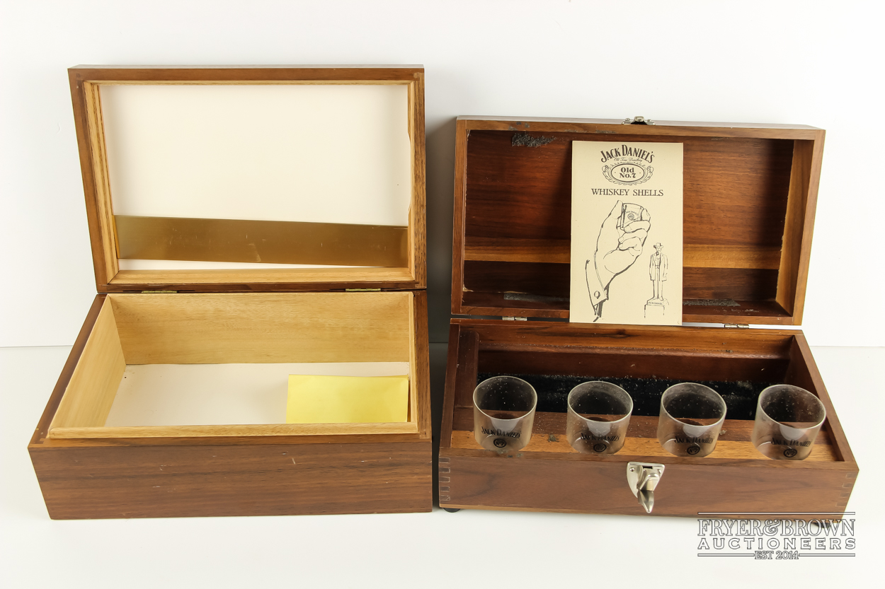 A wooden cigar humidor; and a Jack Daniels wooden presentation box with four shot glasses (2)