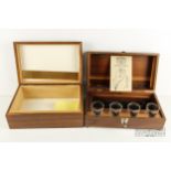 A wooden cigar humidor; and a Jack Daniels wooden presentation box with four shot glasses (2)