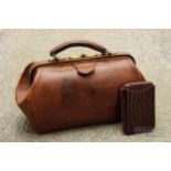 A vintage brown leather bag; and a leather cigar case with faux crocodile patent finish (2)