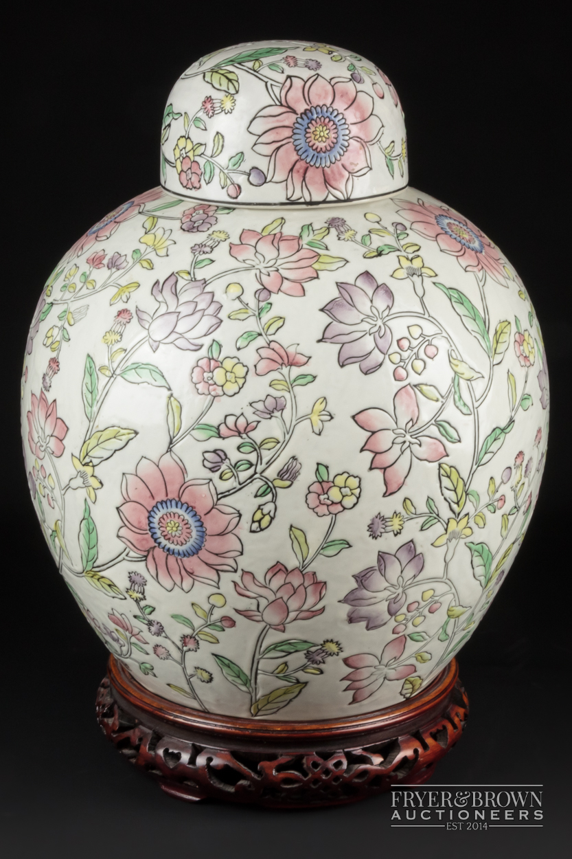 A modern decorative large ginger jar & cover in the Chinese style, decorated all over with flowering