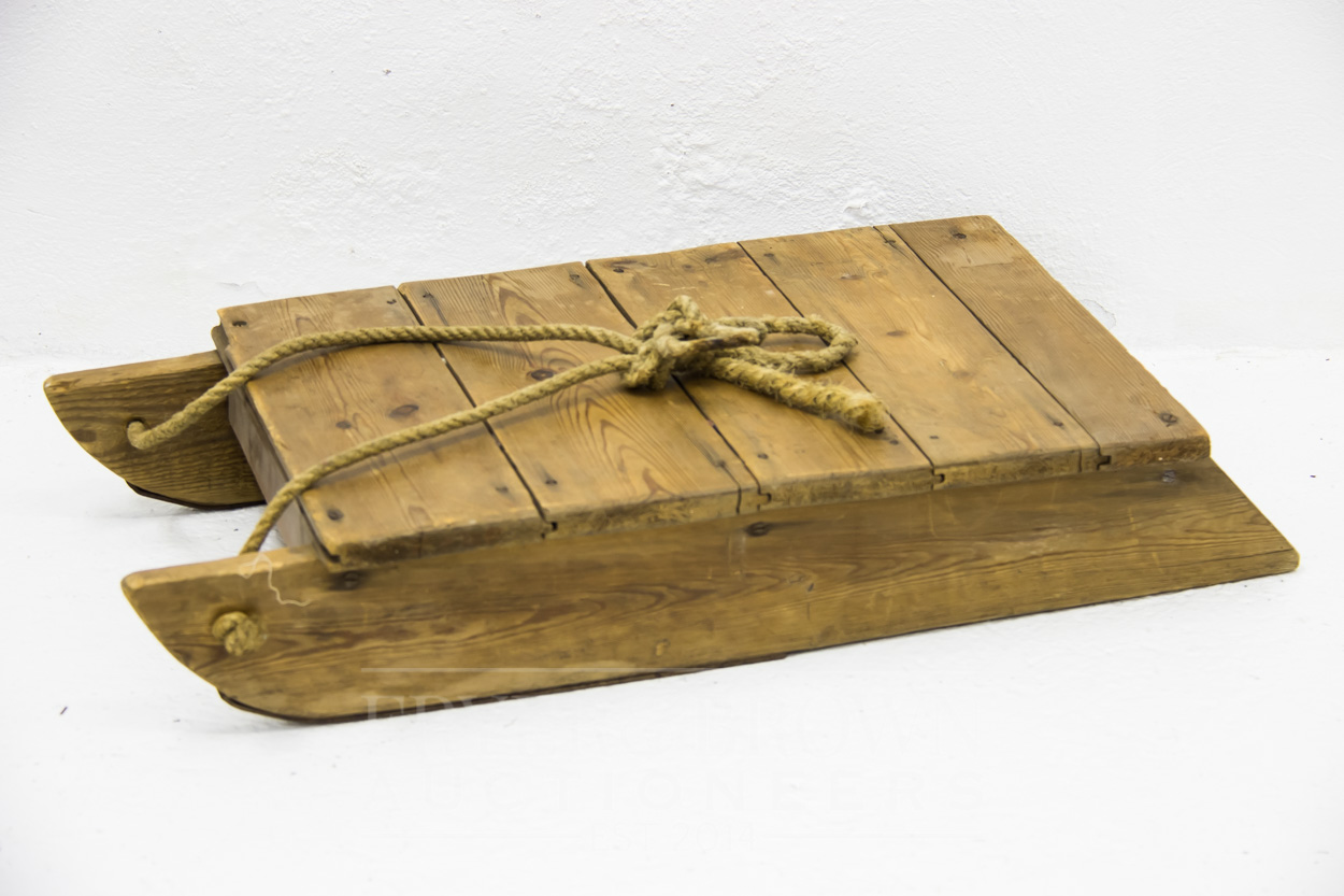 An early 20th century wooden sled