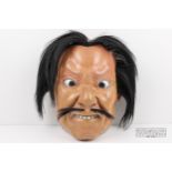 A large Japanese carved wood and lacquer Iki Noh mask, applied horse hair and moustache, with