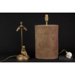 A brass table lamp with pine cone finial and cherub figure to base; and a another lamp base,