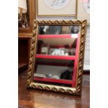 A free standing gilt gesso dressing table mirror