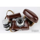 A Voigtlander Bessamatic 35mm Colour-Skopar X 1:2:8/50 camera, with leather case; and a Super-