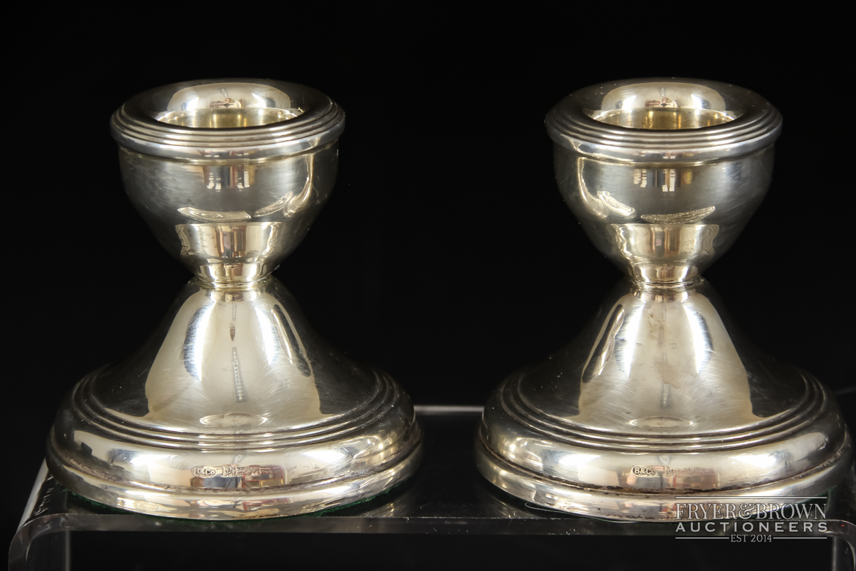 A pair of dwarf candlesticks, makers mark B & Co., Birmingham 1909; and two silver topped cut - Image 2 of 4