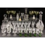 Three moulded and cut glass decanters & stoppers; a smoky glass decanter & stopper; six green