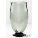 A Scandinavian smoky grey footed glass vase, of tapered cylindrical form on spreading darker