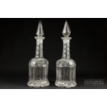 A pair of heavy mallet form decanters, the necks of honeycomb cut, with spire stoppers, 36cm high (