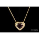 A heart shaped almandine garnet and calibre baguette diamond pendant, the heart shaped garnet of