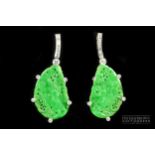 A fine and attractive pair of vintage Chinese jadeite and diamond earrings, the bright apple green