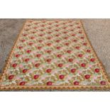 A very large 20th century hand woven tapestry, the ochre ground with pink and red roses, 300 x 424cm