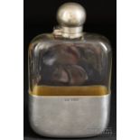 A James Dixon & Sons silver mounted glass hip flask, ball form flip cover, the cup with gilded