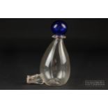 A blown glass bird drinking bottle, the ribbed pear shape bottle with blue ball finial, c1860,