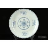 A large 18th century Chinese export porcelain charger, pencilled in blue with a central reserve of a