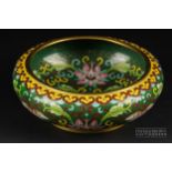 A Chinese cloisonne enamel bowl, circular with everted rim, decorated with pink lily flowers on a