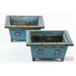 A pair of Chinese cloisonne jardinieres, of rectangular section, decorated with red, white and